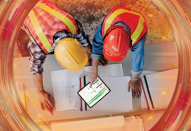 Two construction managers using COINS construction software.